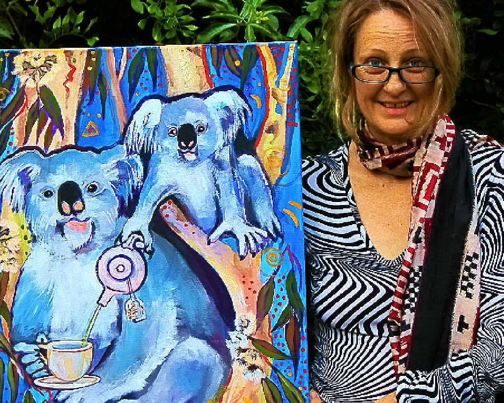 Milly Hine with one of her Australian Bush paintings that feature in the forthcoming exhibition, Menagerie-Doo.